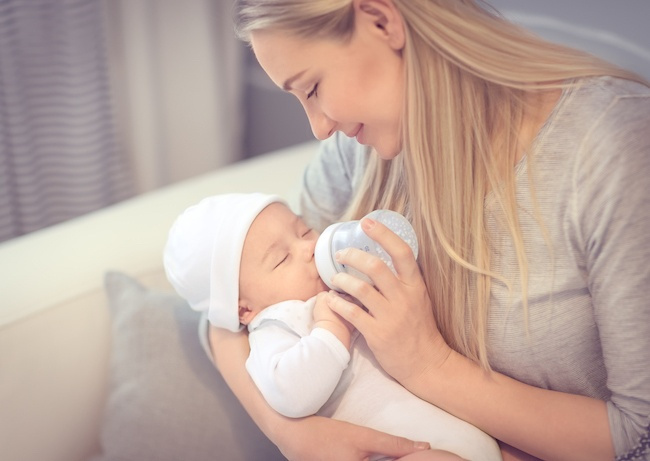 Mother Feeding Baby a Bottle