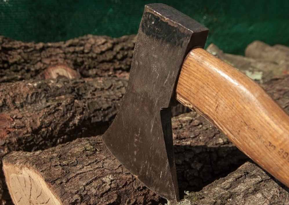 An axe stuck in wood