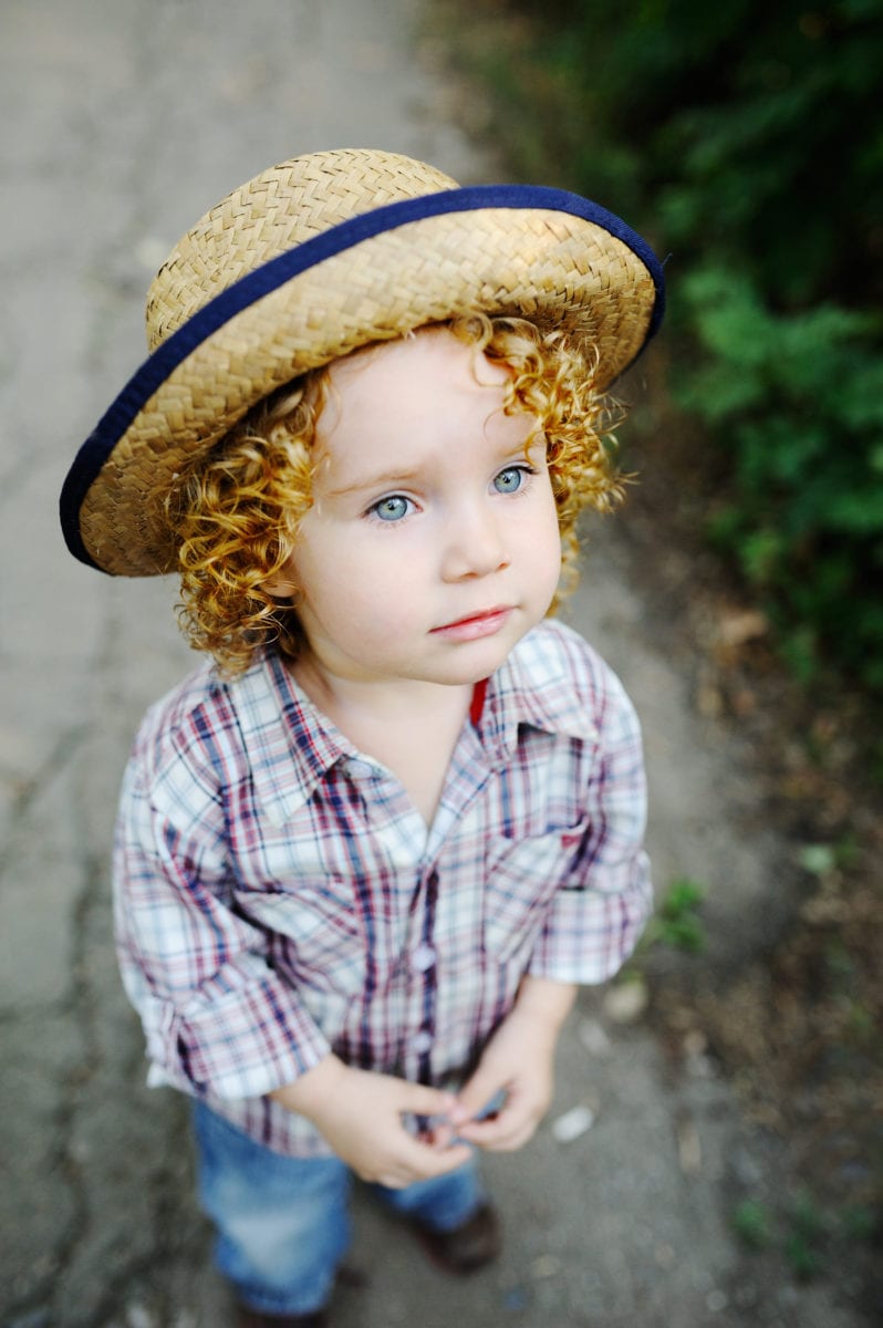 Cute curly haired girl in hat 30 Irish-Inspired Baby Names for Boys and Girls