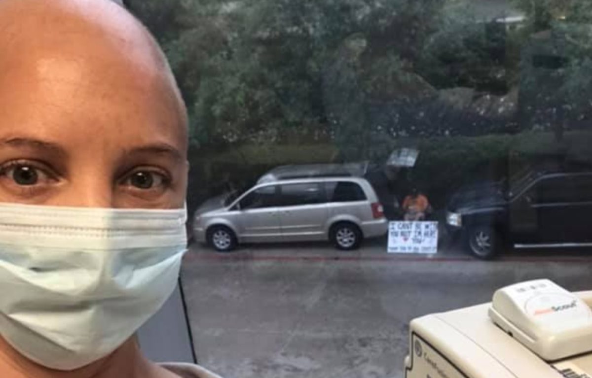 Husband Who Can't Be With His Wife During Her Cancer Treatments Shows Up Outside Her Window to Support Her and the Staff with a Sign