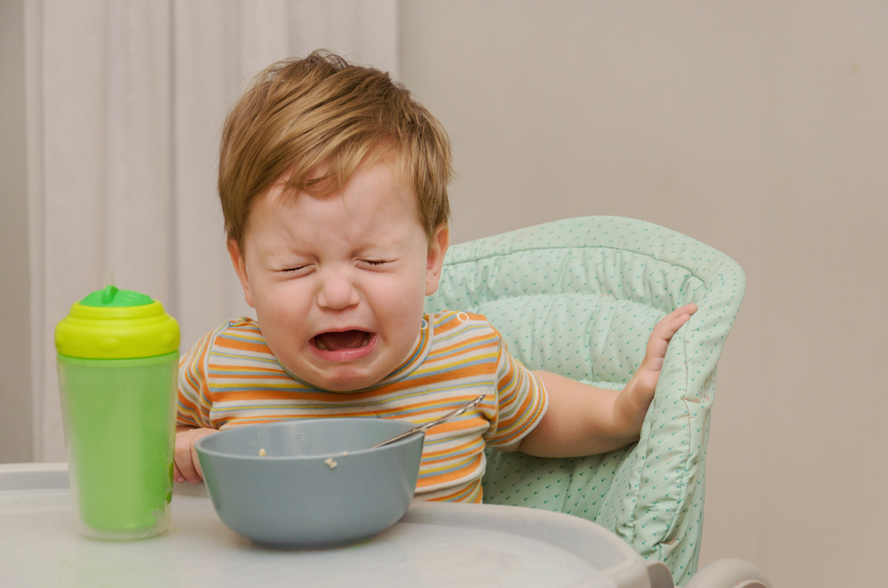 My 10-Month-Old Won't Hold His Bottle — or Really Bring Anything to His Mouth: Should I Be Concerned?