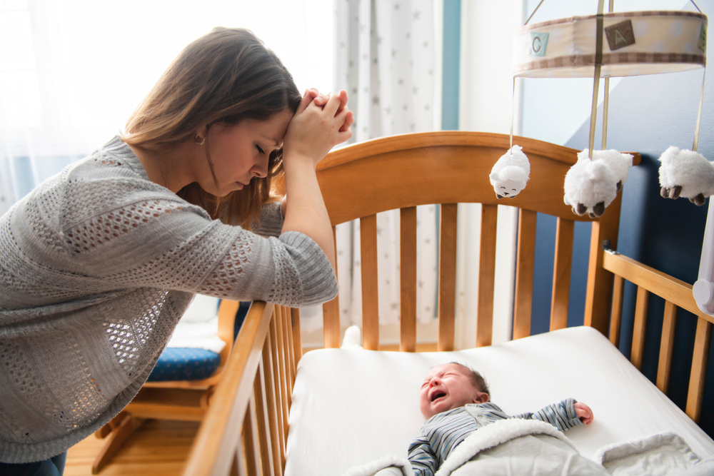 How Do I Get My Newborn to Sleep Anywhere Other Than My Arms?