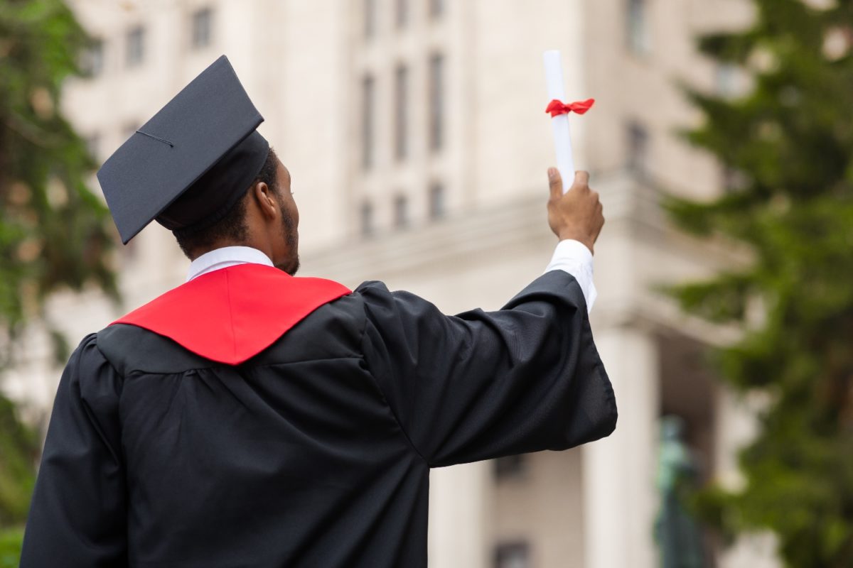 Teacher Steps In After High School Senior Told He Can't Walk At High School Graduation With Sneakers