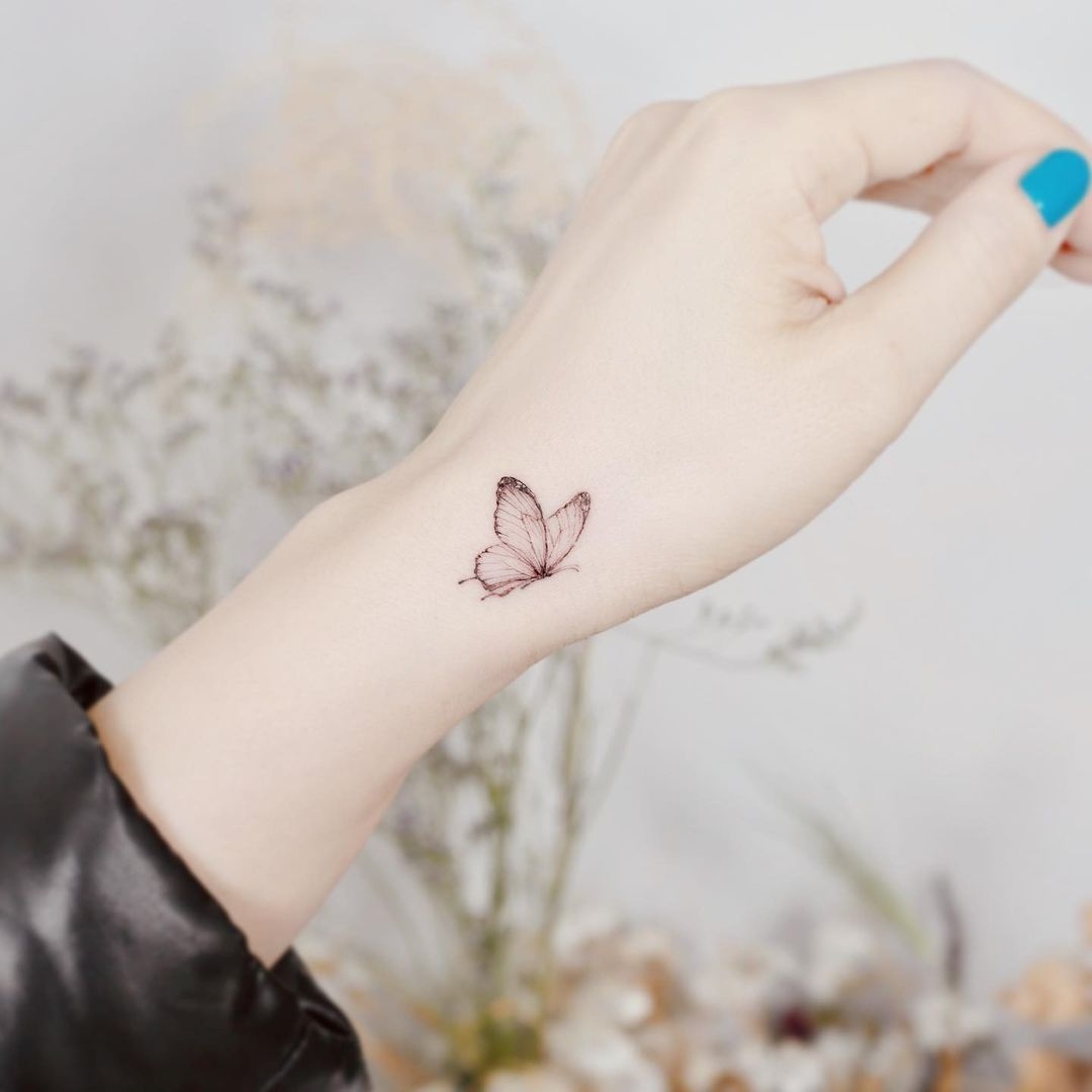 55 Butterfly Hand Tattoo