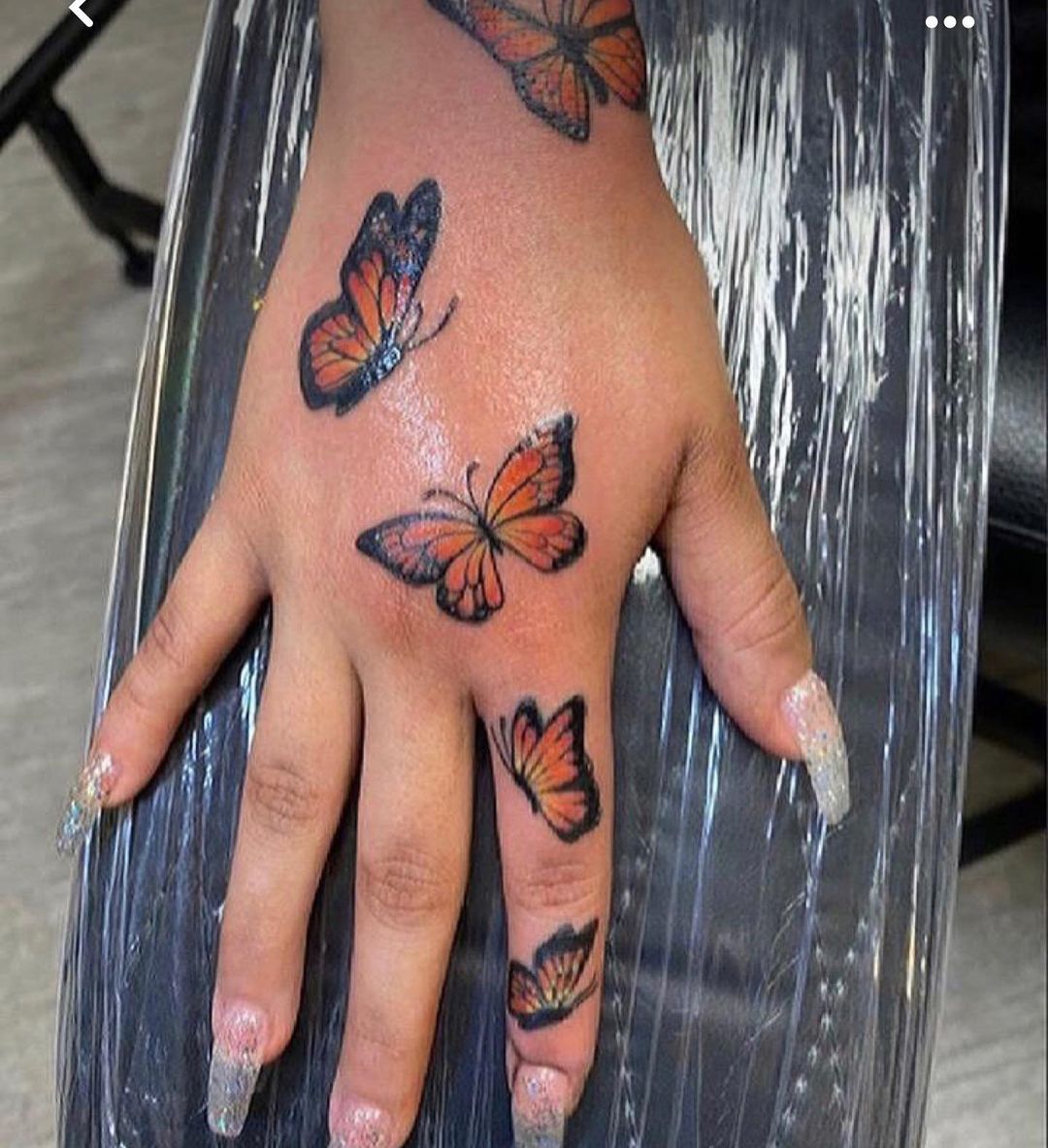 55 Butterfly Hand Tattoo