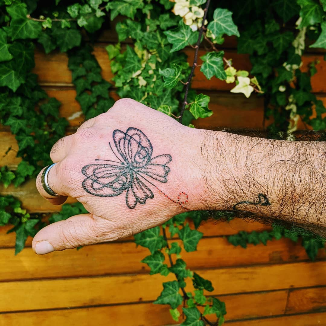 55 Butterfly Hand Tattoo